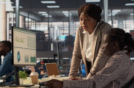 HR professionals analyzing workforce performance data in a modern office